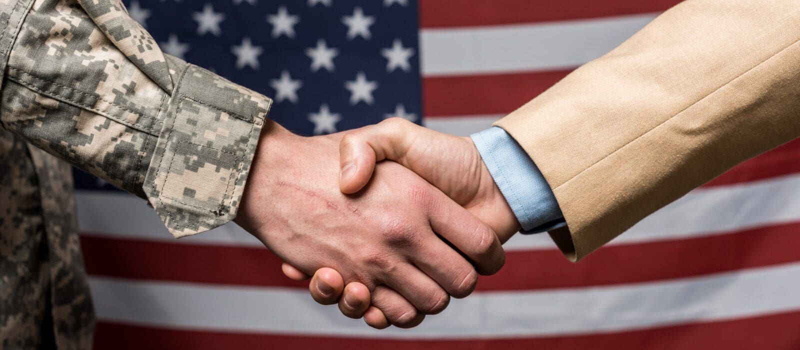 selective-focus-military-men-shaking-hands-nea